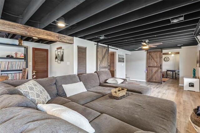 9449 E Lake View Dr, Bonne Terre, MO 63628 - living room featuring a barn door and wood finished floors