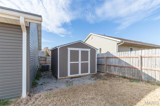 151 Alisha Ave, Poplar Bluff, MO 63901 - view of shed with a fenced backyard and central AC