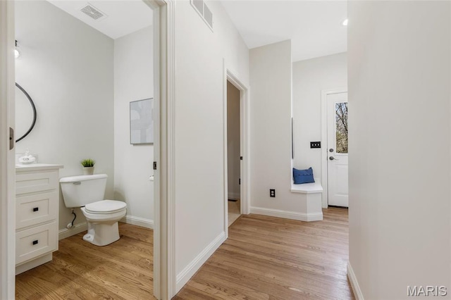 3724 Nadler Rd, Mo, MO 63385 - bathroom with wood finished floors, toilet, baseboards, and vanity
