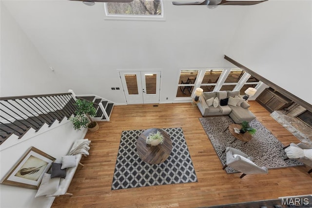 3724 Nadler Rd, Mo, MO 63385 - living room featuring a ceiling fan, a high ceiling, french doors, wood finished floors, and stairway