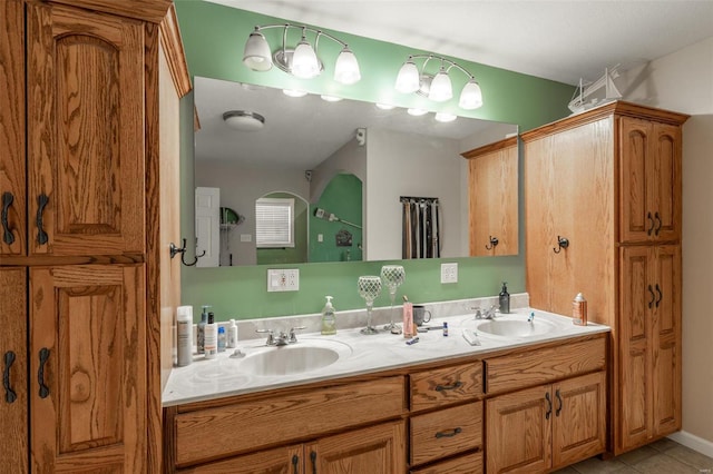 bathroom featuring tile patterned floors and double vanity