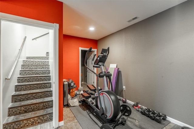 exercise room featuring recessed lighting and baseboards