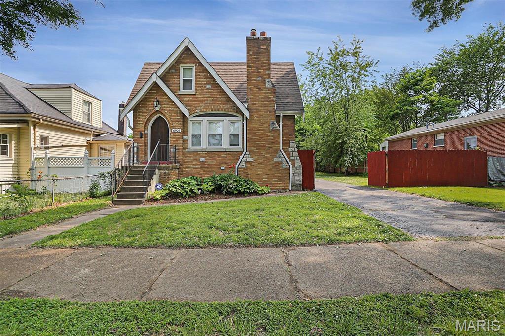 6926 Corbitt Ave, Saint Louis, MO 63130 - english style home featuring brick siding and a chimney