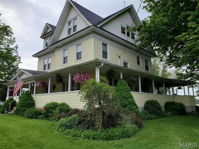 708 E Fillmore St E, Fillmore, IL 62032 - view of side of home with a lawn and roof with shingles