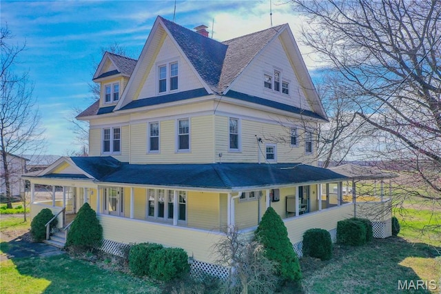 708 E Fillmore St E, Fillmore, IL 62032 - view of side of home featuring a shingled roof, a chimney, a yard, and a porch