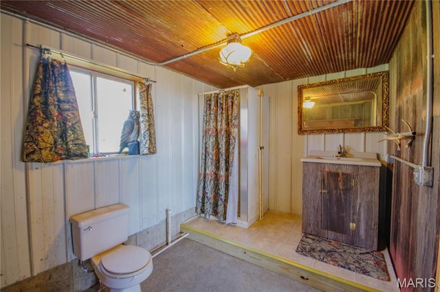 708 E Fillmore St E, Fillmore, IL 62032 - full bath featuring wood walls, vanity, toilet, wooden ceiling, and concrete flooring