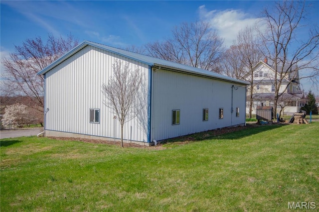 708 E Fillmore St E, Fillmore, IL 62032 - view of property exterior with a yard, an outbuilding, and a pole building