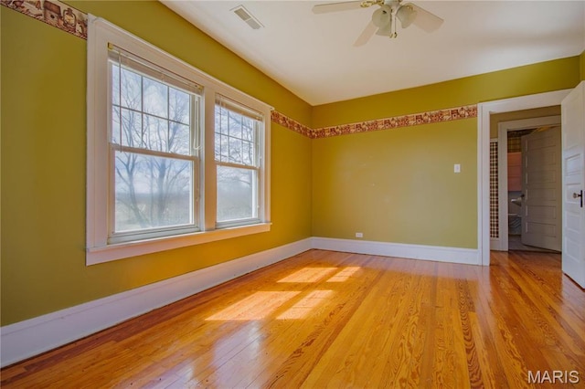 708 E Fillmore St E, Fillmore, IL 62032 - empty room featuring light wood-style floors, a ceiling fan, and baseboards