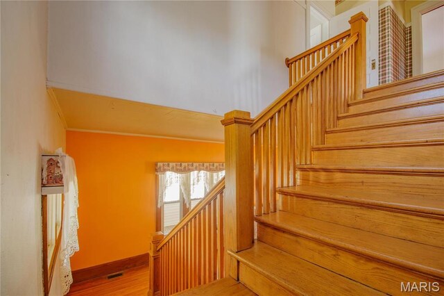 708 E Fillmore St E, Fillmore, IL 62032 - stairs featuring wood finished floors, baseboards, and ornamental molding