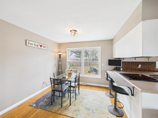 201 Bobby Dale Dr, Waynesville, MO 65583 - dining room featuring light wood finished floors and baseboards