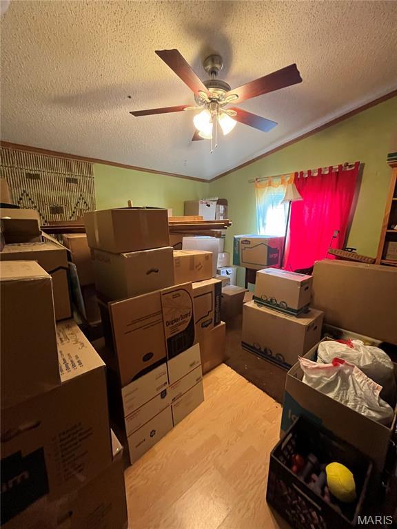 storage area featuring ceiling fan