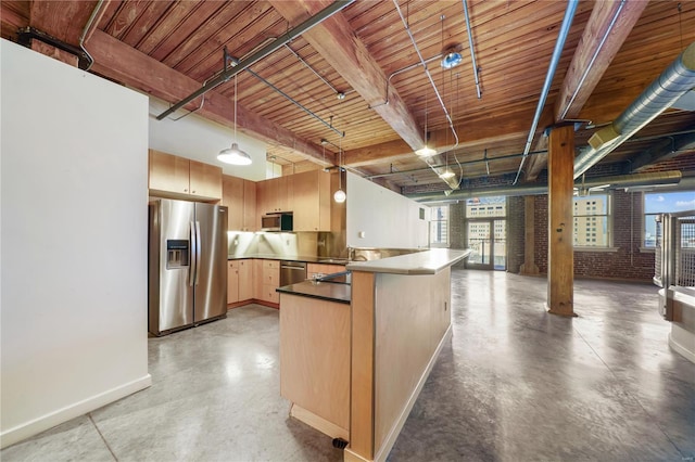kitchen featuring stainless steel appliances, concrete floors, a peninsula, baseboards, and light brown cabinetry