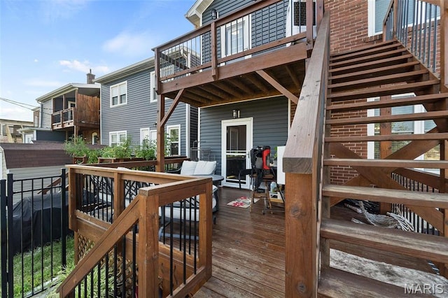 wooden terrace featuring stairs