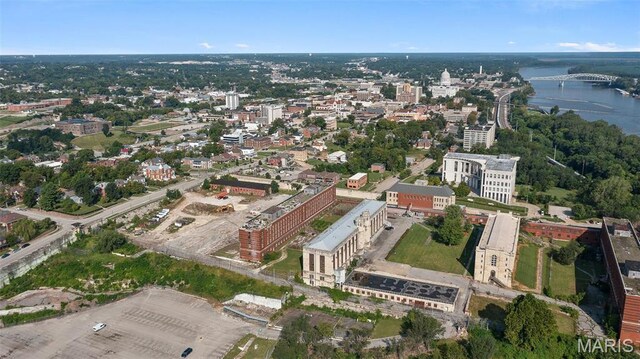 aerial view of property's location with a nearby body of water and a notable bridge