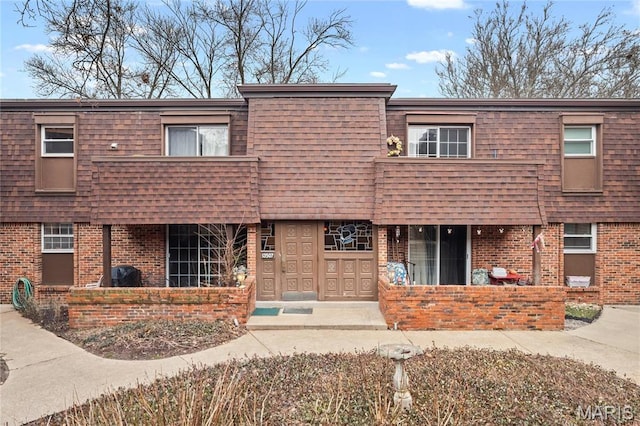 13507 Coliseum Dr Unit F, Chesterfield, MO 63017 - view of front of home with brick siding and mansard roof