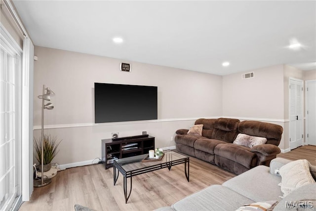 13507 Coliseum Dr Unit F, Chesterfield, MO 63017 - living area featuring wood finished floors, baseboards, and recessed lighting
