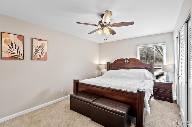 13507 Coliseum Dr Unit F, Chesterfield, MO 63017 - bedroom with light carpet, baseboards, a closet, and a ceiling fan