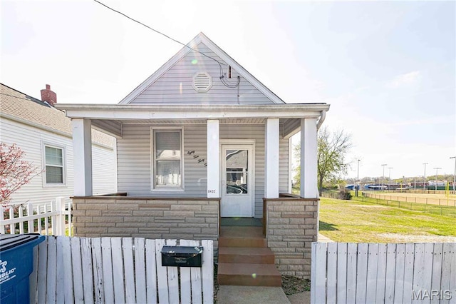 8432 Tennessee Ave, Saint Louis, MO 63125 - shotgun-style home with covered porch