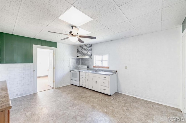 8432 Tennessee Ave, Saint Louis, MO 63125 - kitchen featuring electric range, a sink, a ceiling fan, a drop ceiling, and light countertops