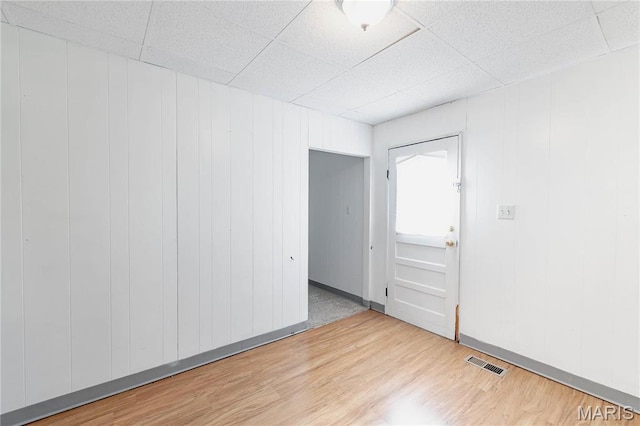 8432 Tennessee Ave, Saint Louis, MO 63125 - empty room with wood finished floors and a paneled ceiling