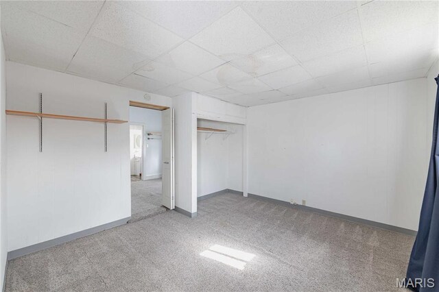 8432 Tennessee Ave, Saint Louis, MO 63125 - unfurnished bedroom with carpet floors, baseboards, a closet, and a paneled ceiling