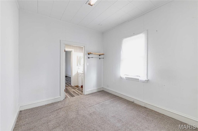 8432 Tennessee Ave, Saint Louis, MO 63125 - unfurnished bedroom featuring carpet, ensuite bath, and baseboards