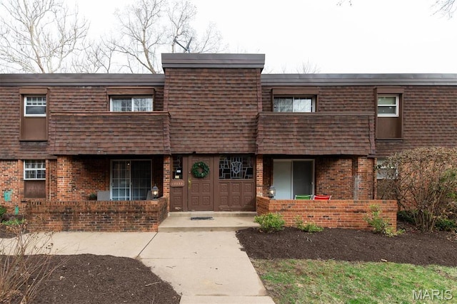 13555 Coliseum Dr Unit G, Chesterfield, MO 63017 - view of front facade featuring brick siding and mansard roof