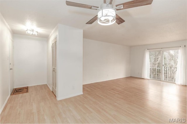 13555 Coliseum Dr Unit G, Chesterfield, MO 63017 - spare room featuring wood finished floors, ceiling fan, and baseboards