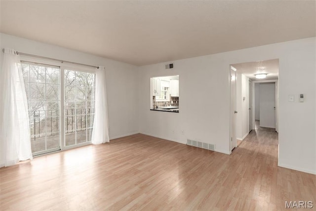 13555 Coliseum Dr Unit G, Chesterfield, MO 63017 - spare room featuring light wood-type flooring and baseboards