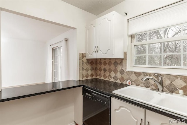 13555 Coliseum Dr Unit G, Chesterfield, MO 63017 - kitchen featuring dishwasher, a sink, white cabinets, and tasteful backsplash