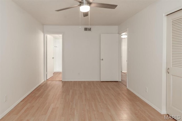 13555 Coliseum Dr Unit G, Chesterfield, MO 63017 - unfurnished bedroom with light wood-style flooring, baseboards, and ceiling fan