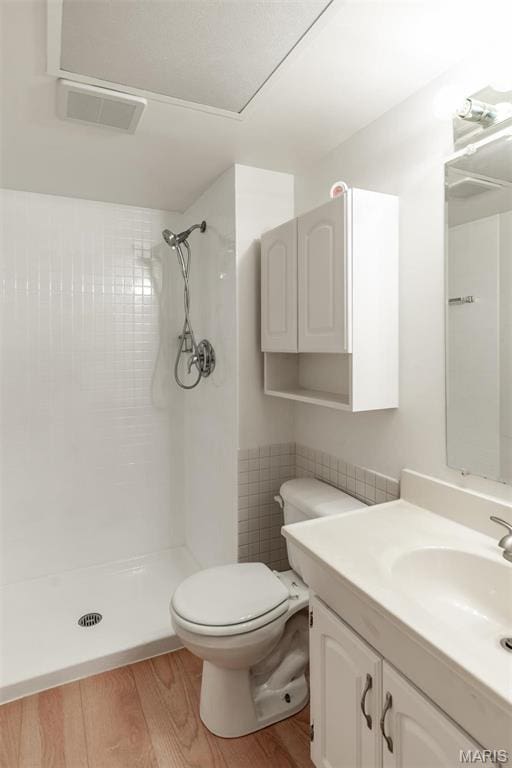 13555 Coliseum Dr Unit G, Chesterfield, MO 63017 - full bath with a shower, wood finished floors, toilet, and vanity