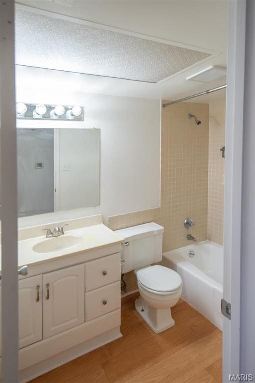 13555 Coliseum Dr Unit G, Chesterfield, MO 63017 - full bath featuring toilet, vanity, wood finished floors, and shower / bathtub combination