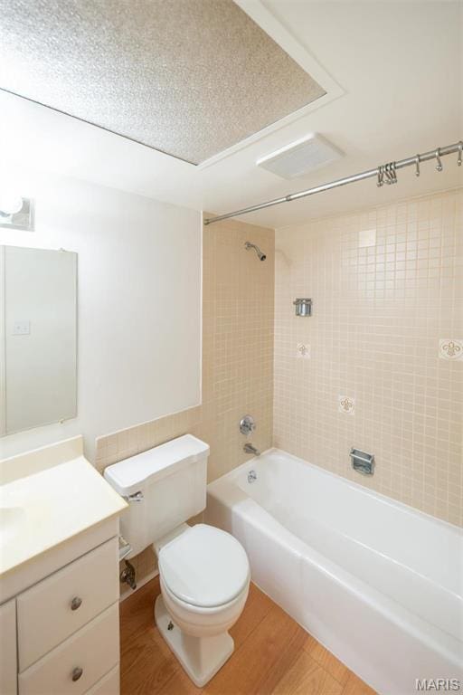 13555 Coliseum Dr Unit G, Chesterfield, MO 63017 - bathroom featuring vanity, toilet, washtub / shower combination, and wood finished floors