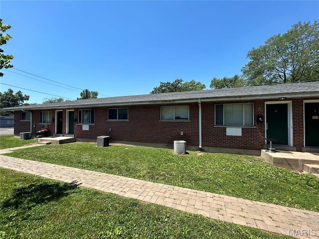 1209 Chambers Rd, Ferguson, MO 63135 - ranch-style home with a front lawn and brick siding