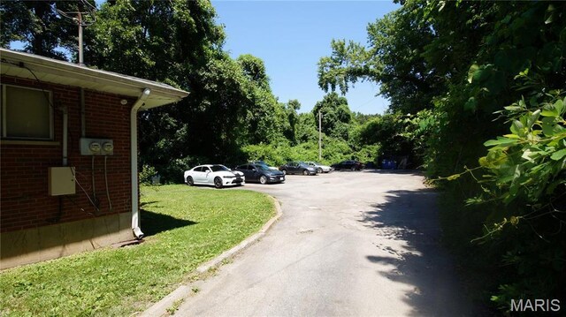 1209 Chambers Rd, Ferguson, MO 63135 - view of asphalt street featuring curbs