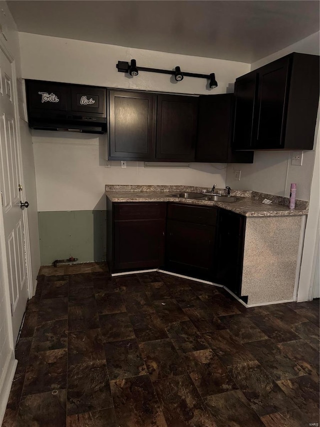 6859 Stratford Ave, Pine Lawn, MO 63121 - kitchen with a sink and dark cabinets