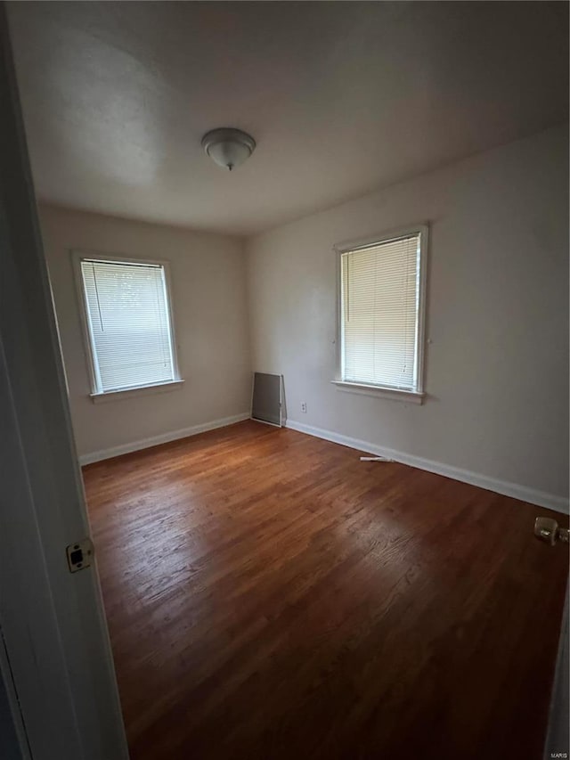 6859 Stratford Ave, Pine Lawn, MO 63121 - empty room with baseboards and wood finished floors