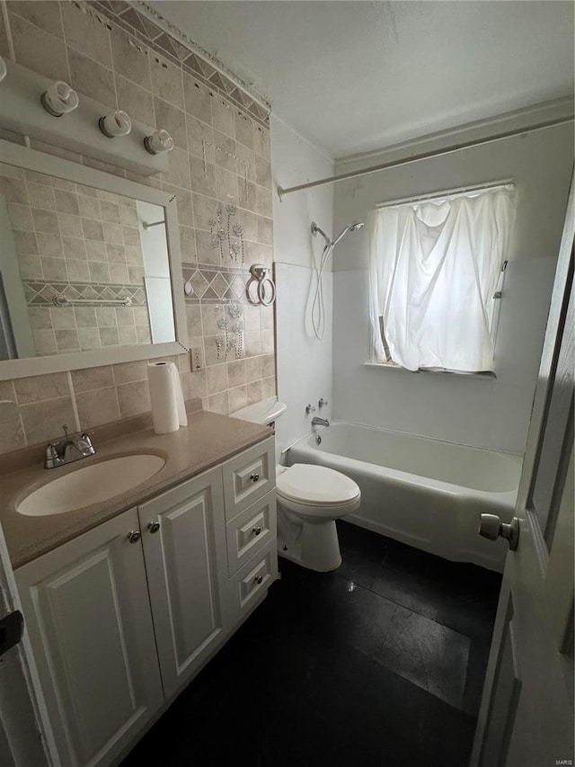 6859 Stratford Ave, Pine Lawn, MO 63121 - bathroom with tile walls, vanity, bathing tub / shower combination, tile patterned floors, and toilet