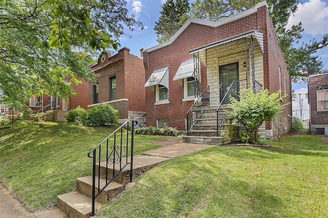 4242 Walsh St, Saint Louis, MO 63116 - view of front of home with brick siding and a front yard