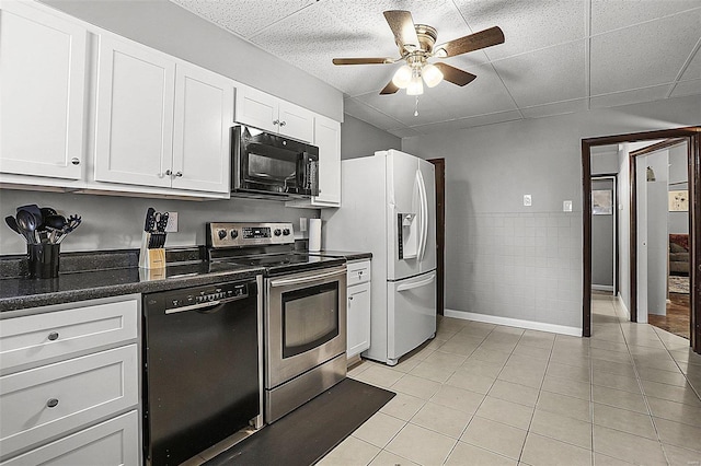 4242 Walsh St, Saint Louis, MO 63116 - kitchen featuring black appliances, ceiling fan, light tile patterned flooring, white cabinetry, and dark stone countertops
