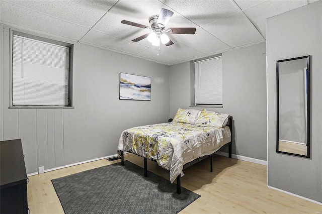 4242 Walsh St, Saint Louis, MO 63116 - bedroom with a paneled ceiling, wood finished floors, ceiling fan, and baseboards