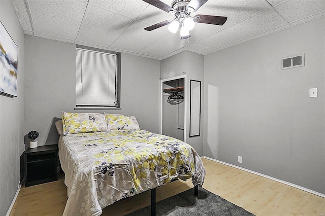 4242 Walsh St, Saint Louis, MO 63116 - bedroom with wood finished floors, a drop ceiling, baseboards, and a ceiling fan