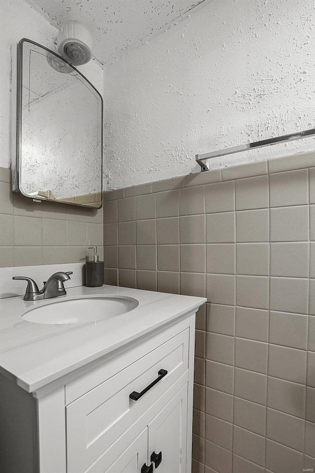 4242 Walsh St, Saint Louis, MO 63116 - bathroom featuring tile walls, vanity, and backsplash