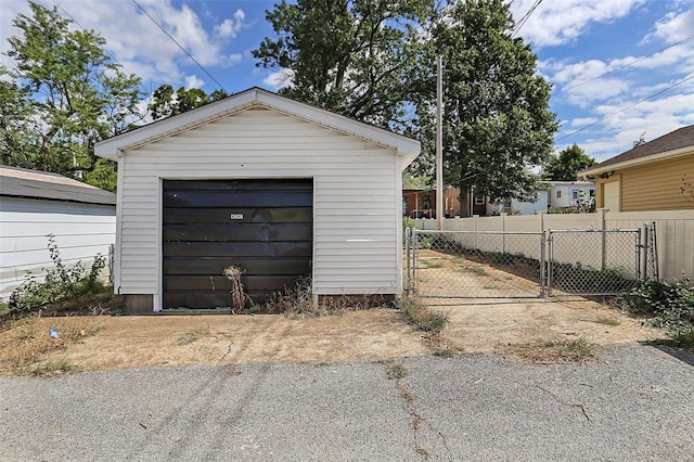 4242 Walsh St, Saint Louis, MO 63116 - detached garage featuring fence and driveway