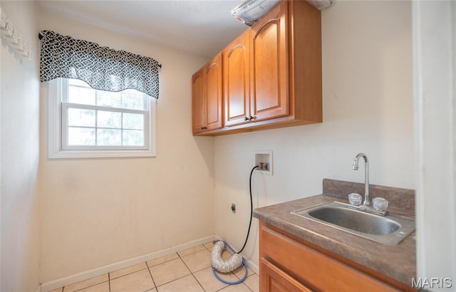 10625 Pine Needle Cir, Rolla, MO 65401 - laundry room featuring hookup for an electric dryer, cabinet space, hookup for a washing machine, light tile patterned floors, and baseboards