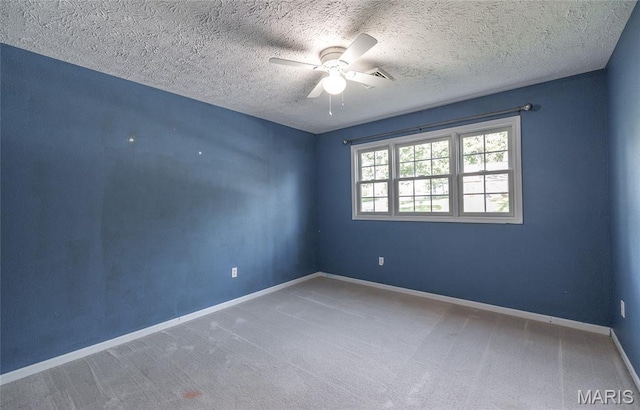 10625 Pine Needle Cir, Rolla, MO 65401 - carpeted spare room featuring ceiling fan, baseboards, and a textured ceiling