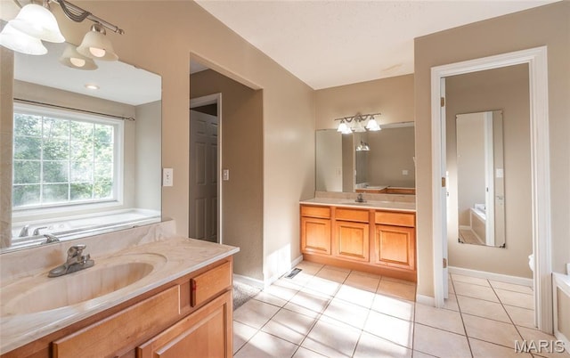 10625 Pine Needle Cir, Rolla, MO 65401 - bathroom with vanity, tile patterned floors, baseboards, and a chandelier