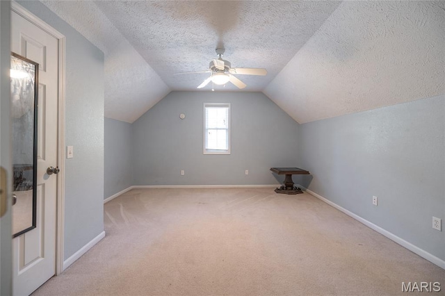 10625 Pine Needle Cir, Rolla, MO 65401 - bonus room with carpet, baseboards, a textured ceiling, lofted ceiling, and ceiling fan