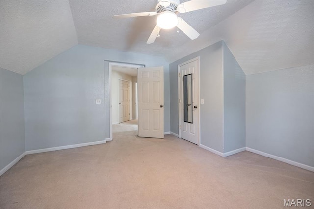 10625 Pine Needle Cir, Rolla, MO 65401 - bonus room featuring vaulted ceiling, light colored carpet, a textured ceiling, and baseboards